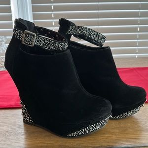 Black wedge booties with silver spikes